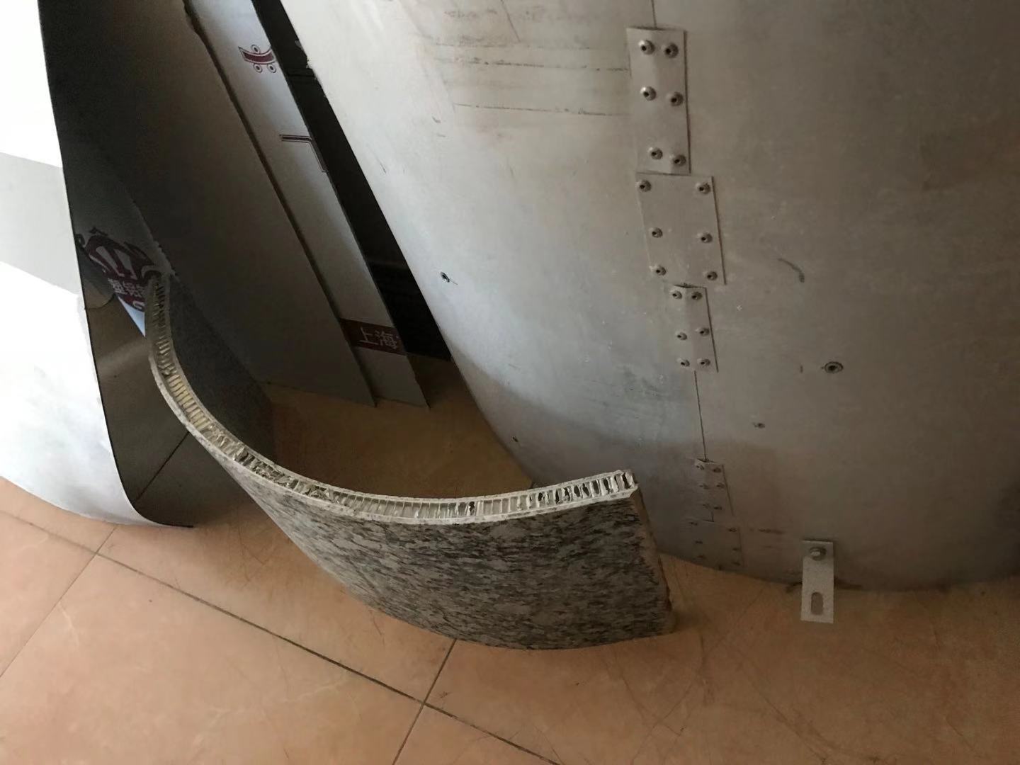 Curved stone column covers in honeycomb panel